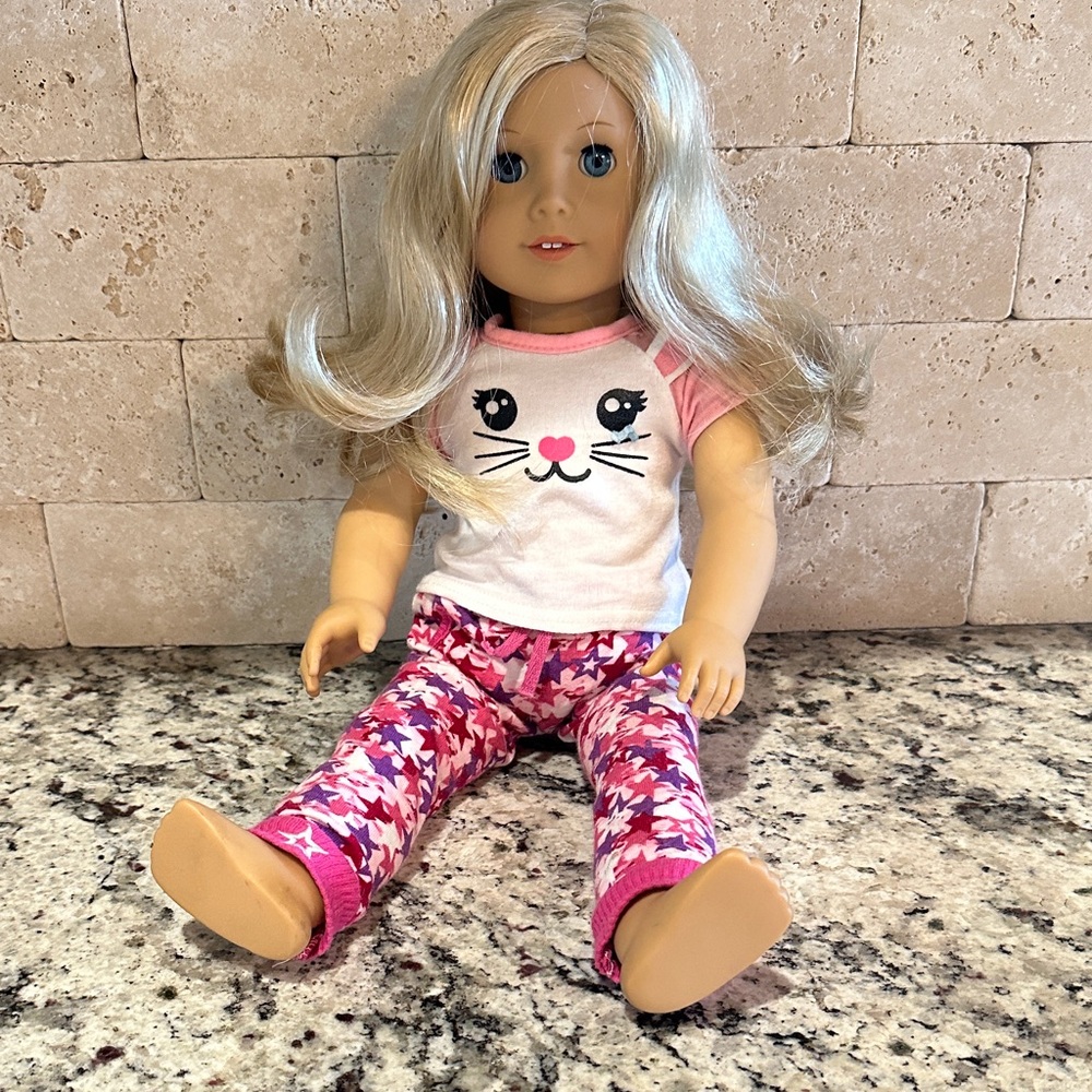 American Girl Doll with Blonde Hair and Pink Floral Outfit